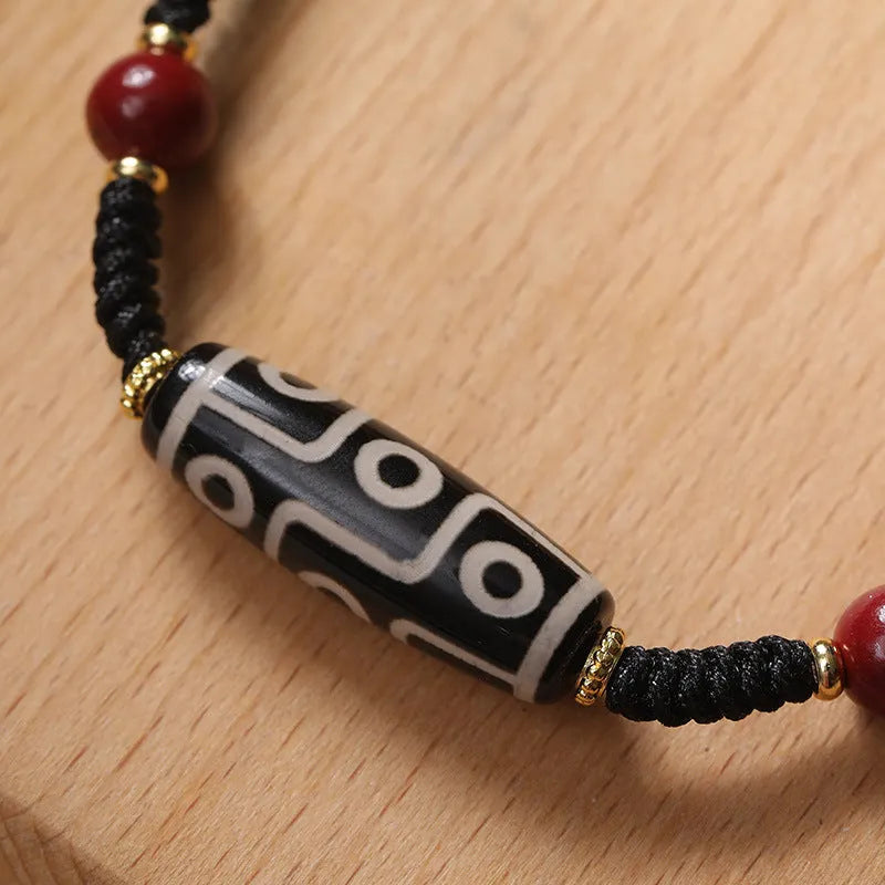 Tibetan agate dzi bead bracelet with adjustable shrinkable fit showing natural stone beads