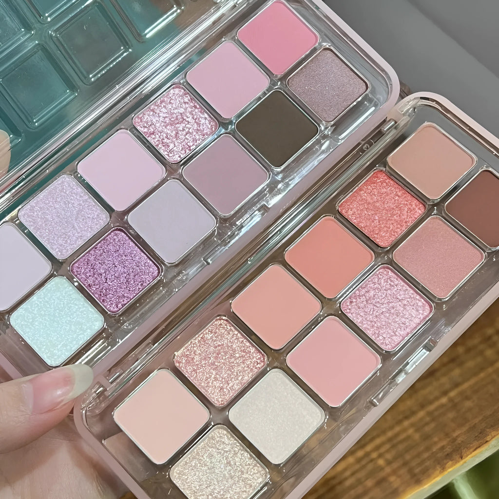 Makeup eyeshadow palette showing twelve different colours in compact case