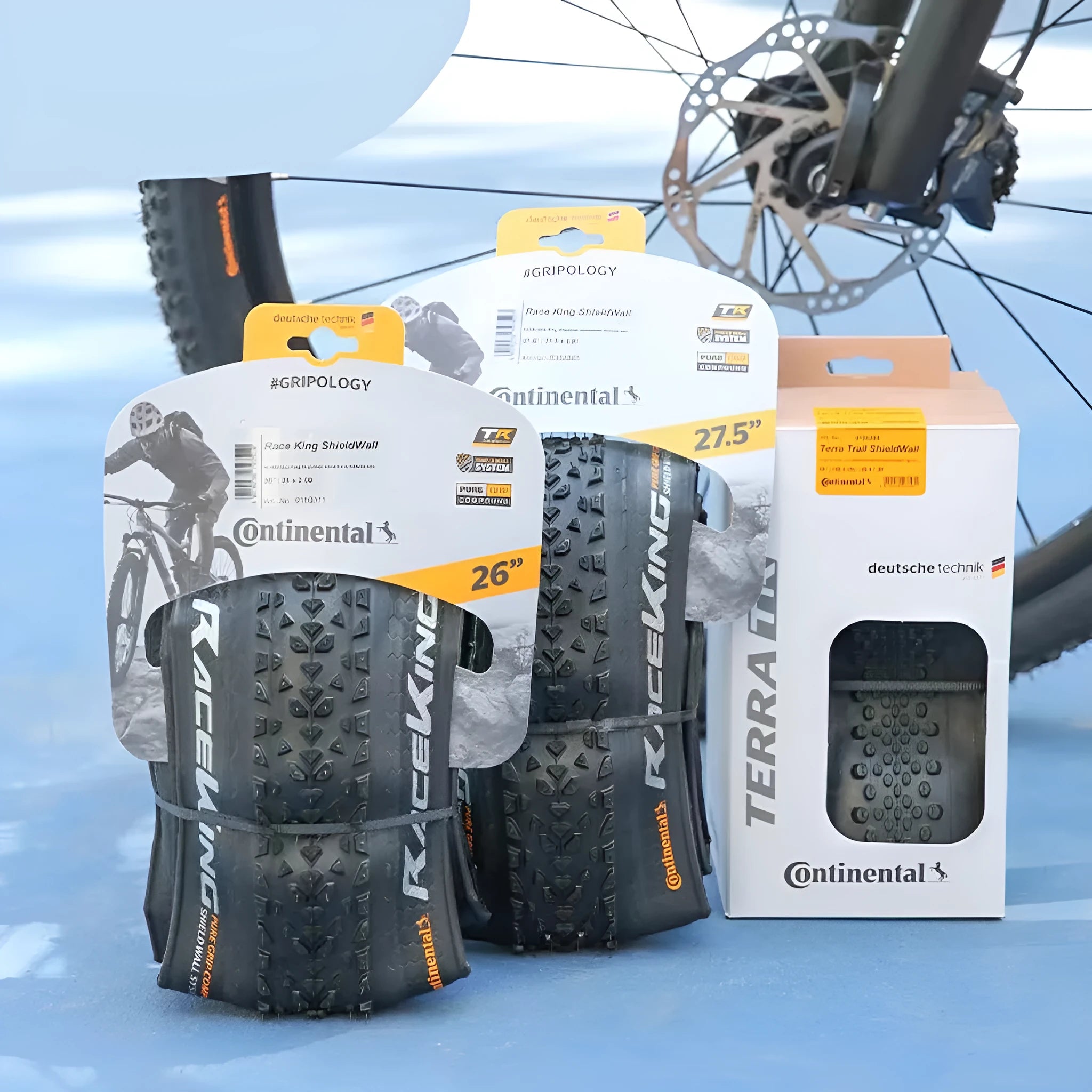 Mountain bike tyre showing tread pattern, available in 26, 27.5 and 29-inch sizes with folding or wire bead.
