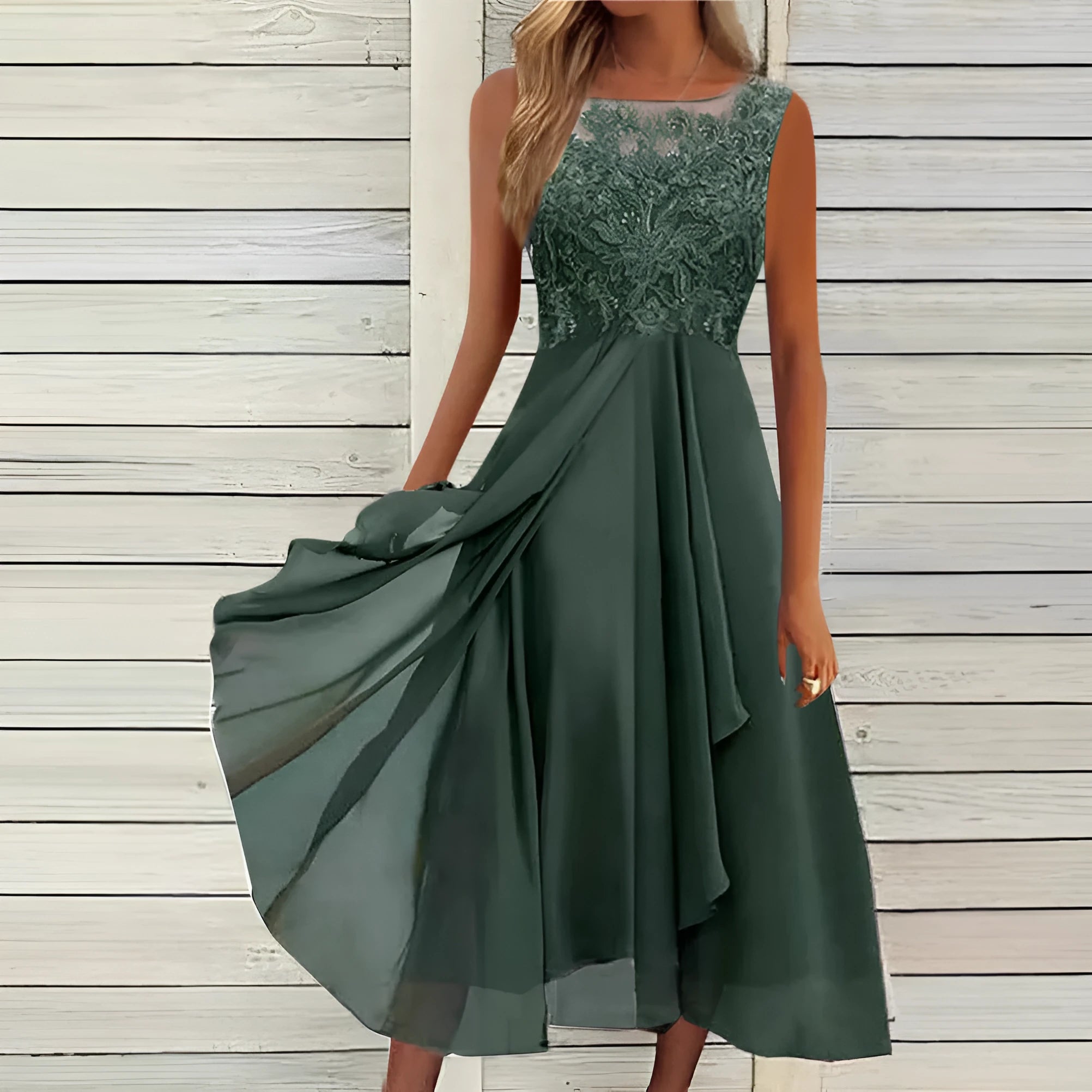 Women's sleeveless green chiffon dress with lace stitching and a mid-length skirt.