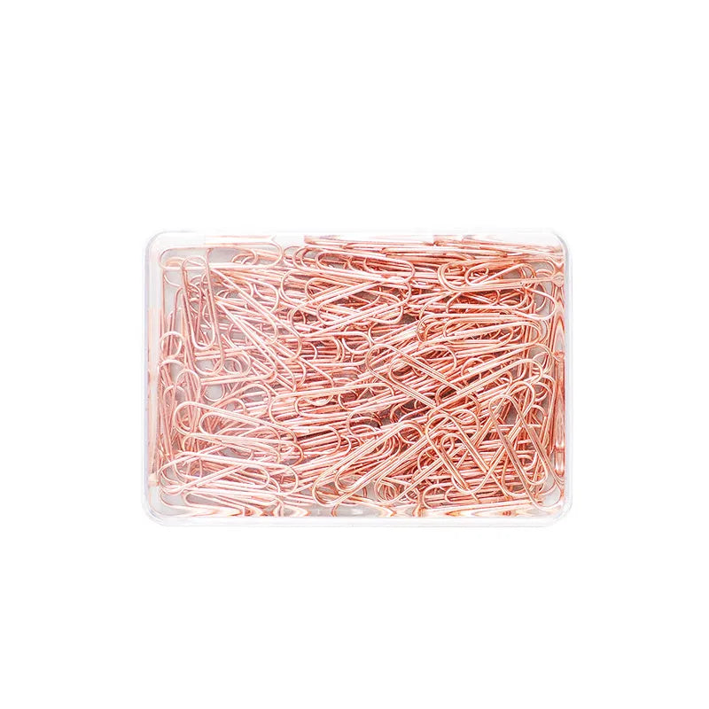 Box of 100 rose gold heart-shaped steel paper clips on a white background.