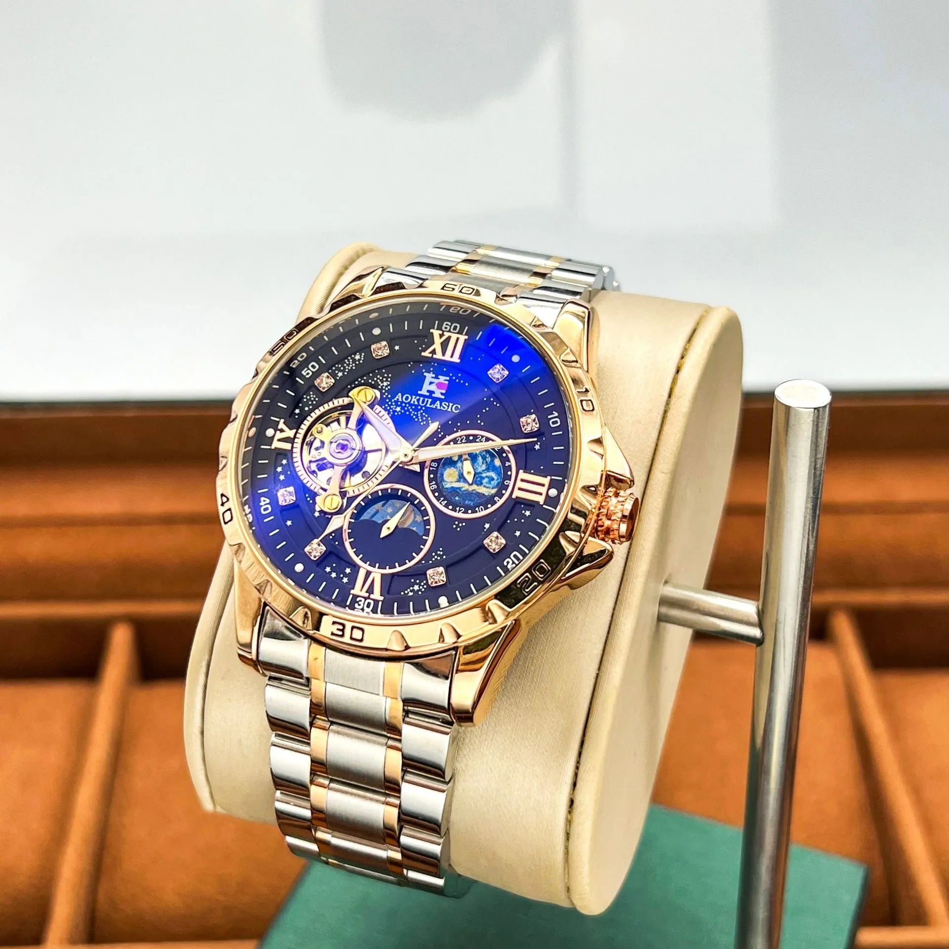 Men's automatic mechanical watch with large dial, rose gold case, and black face.