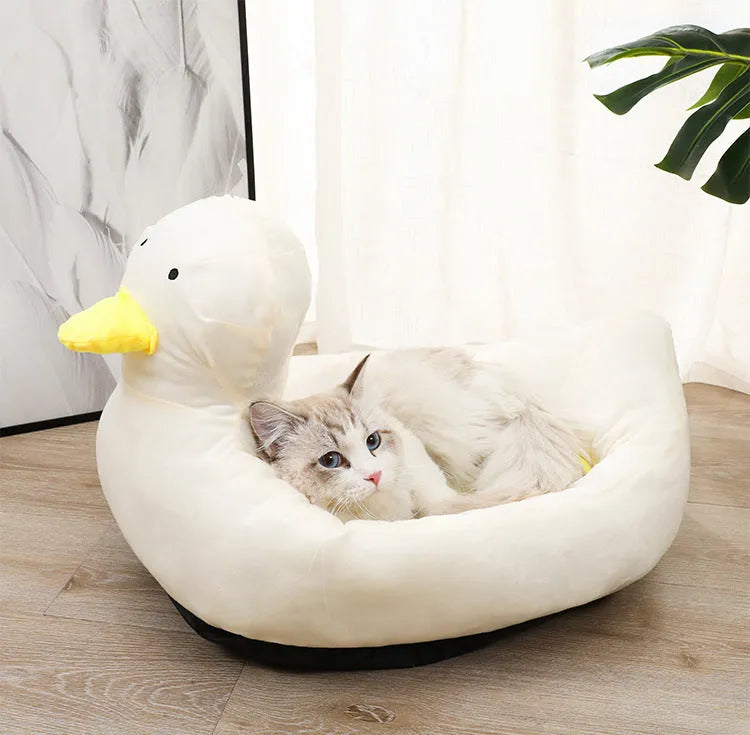 Blue duck-shaped fluffy pet bed sofa for a small dog, showing raised sides and soft material.