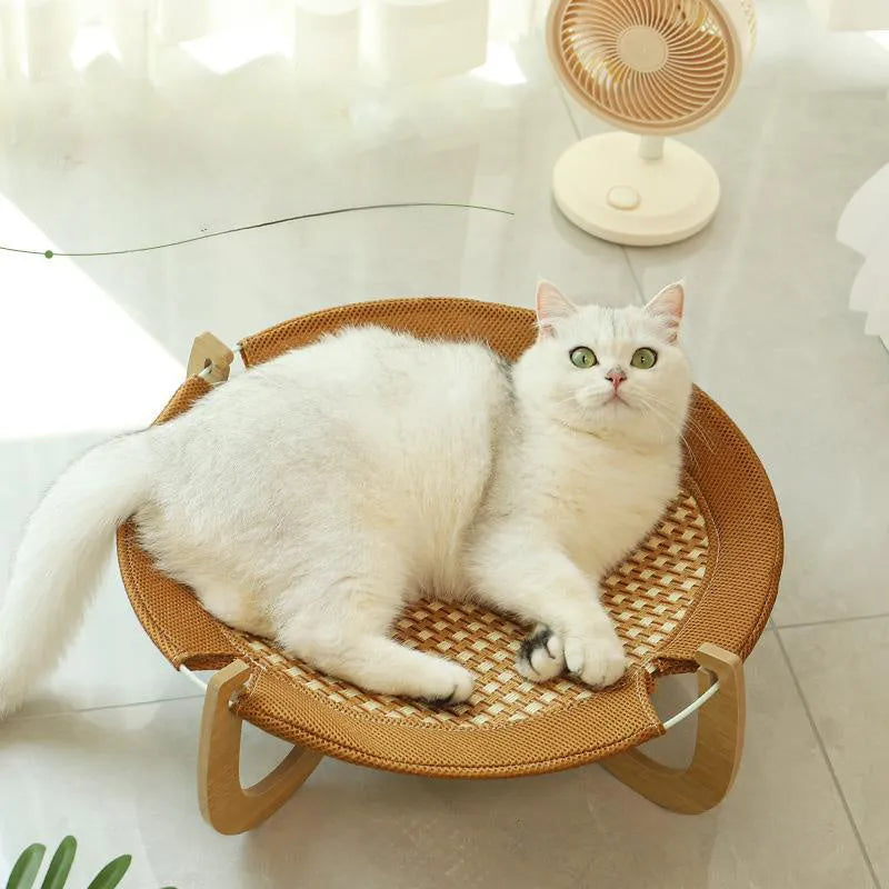Brown woven rattan pet hammock bed with a cool mat for cats and small dogs.