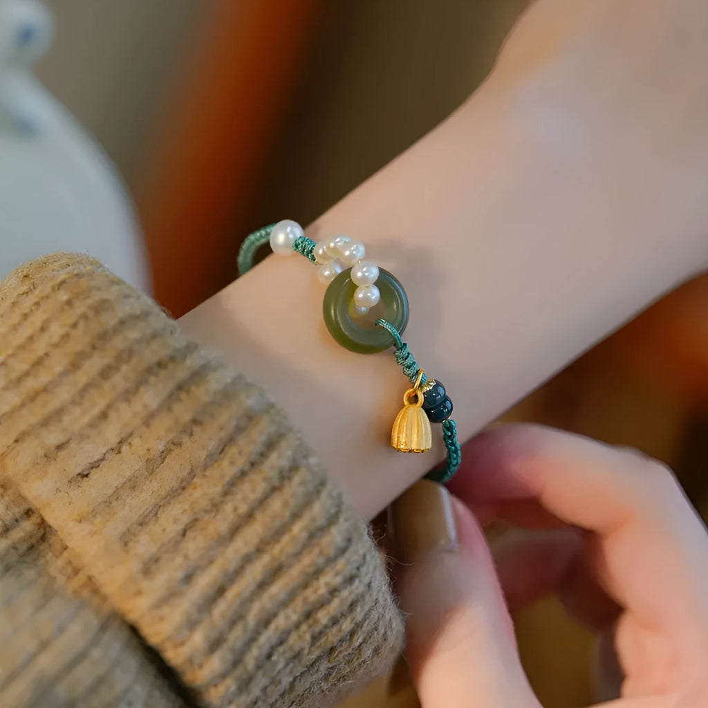Hand-woven flexible wire watch band with a pearl peace buckle closure