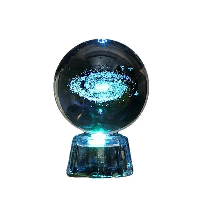 Transparent white luminous crystal ball ornament with inner carving on a fixed base for tabletop decor.