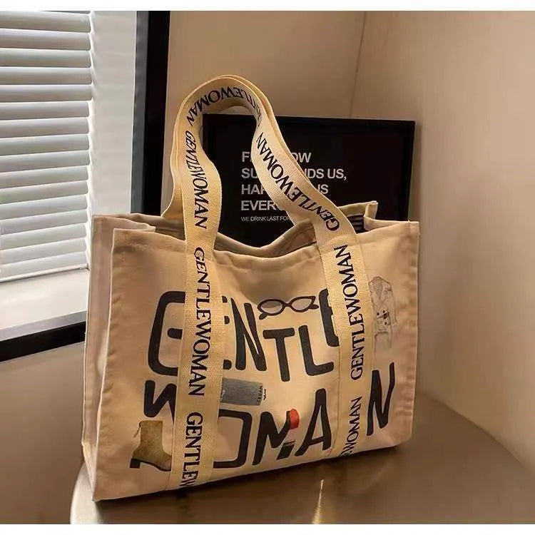 Large canvas tote bag with printed design options for travel and shopping
