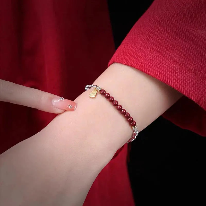Silver electroplated copper lucky beads bracelet with geometric round beads on wrist