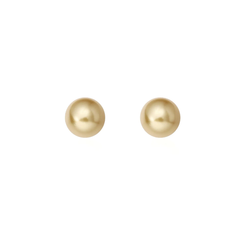 A pair of large geometric silver stud earrings with a central pearl and an eight-point star design detail.