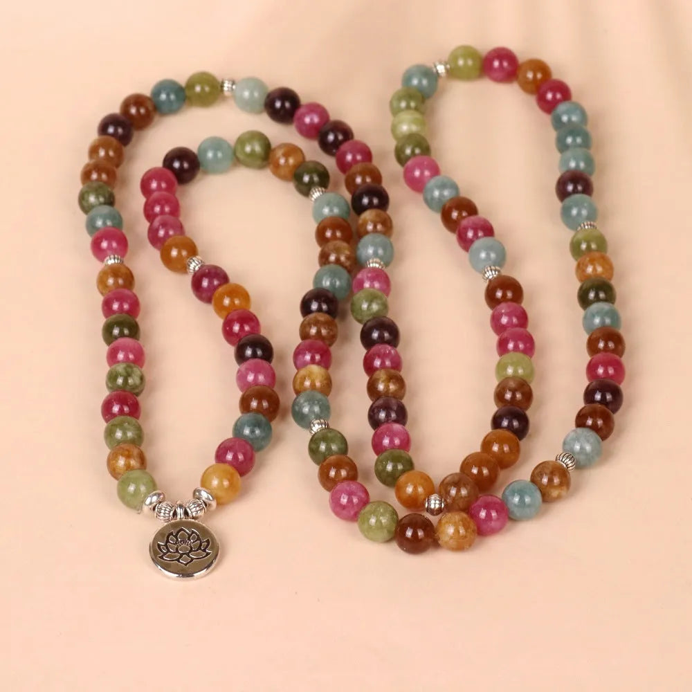 Close-up of a 108-bead alloy bracelet with a multi-layer lotus string design in a tourmaline colour.