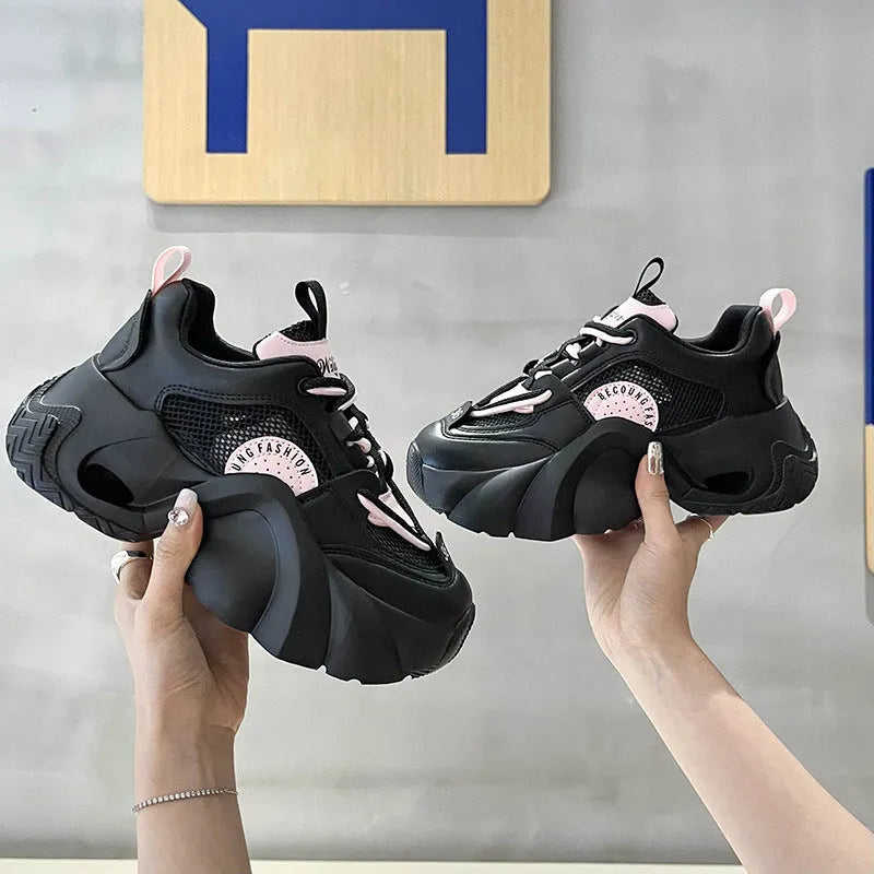 Women's pink sneakers with cross strap design and thick platform sole