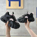 Women's pink sneakers with cross strap design and thick platform sole