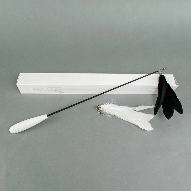 White telescopic cat fishing rod extended with goose feather lure and removable pen attachment