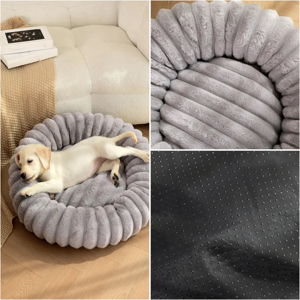 A round, plush beige pet nest bed for cats or dogs on a wooden floor.