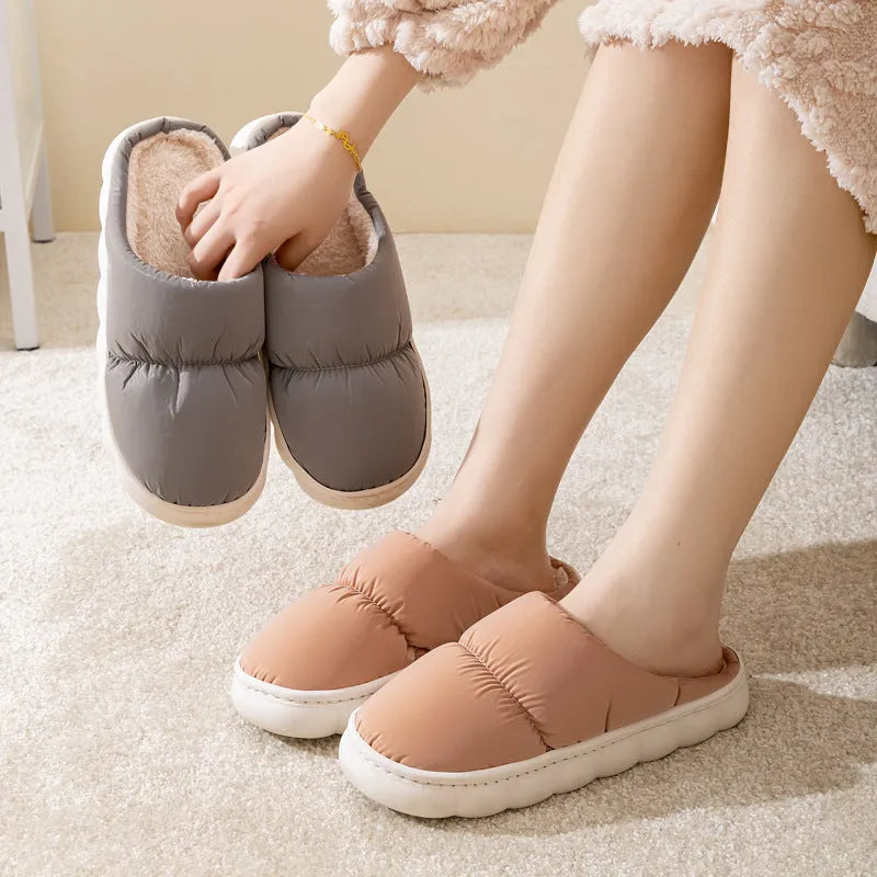 Down cotton house slippers with artificial leather upper, rubber sole, and plush lining in blue colour