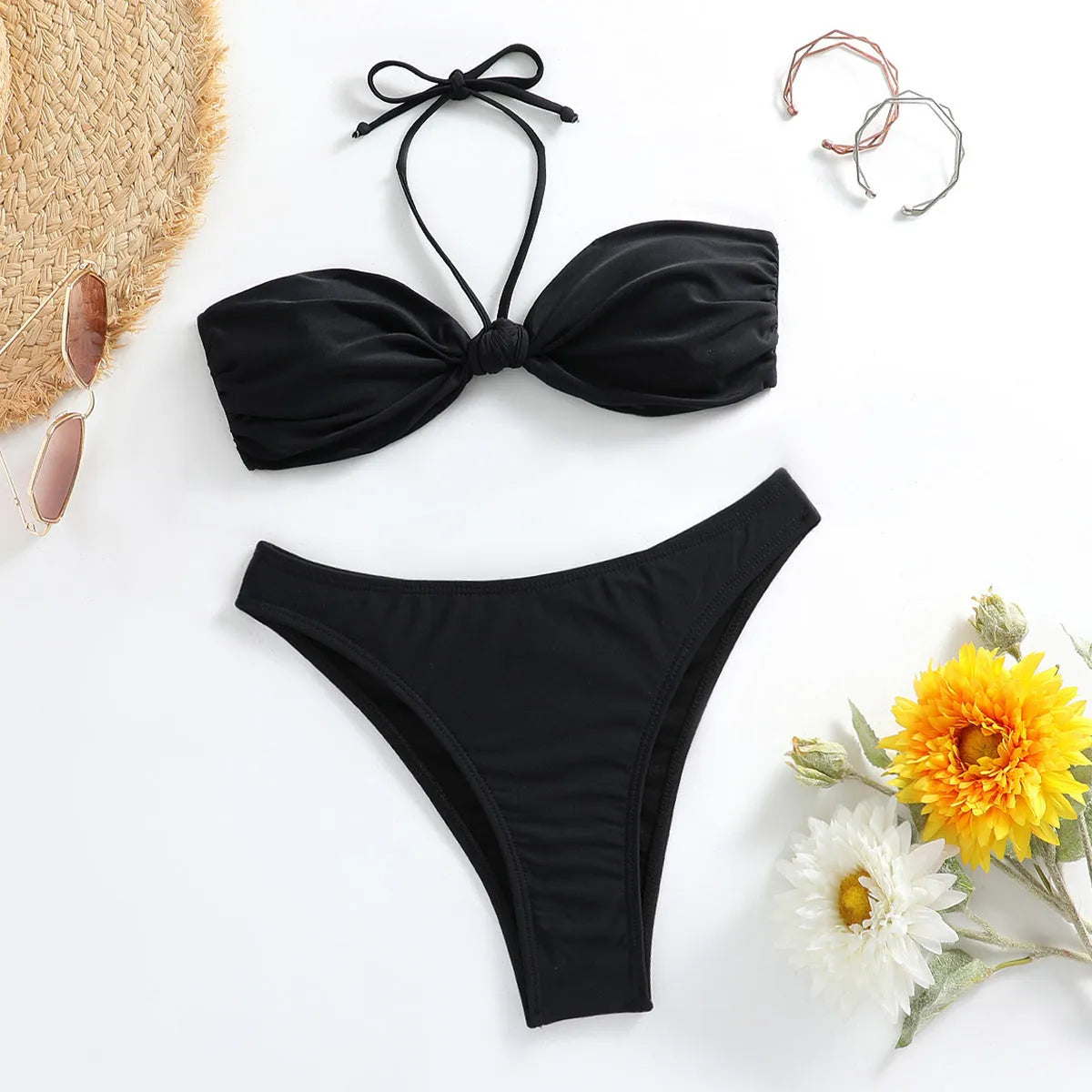 Black women's bikini set with lace-up tube top and briefs on mannequin