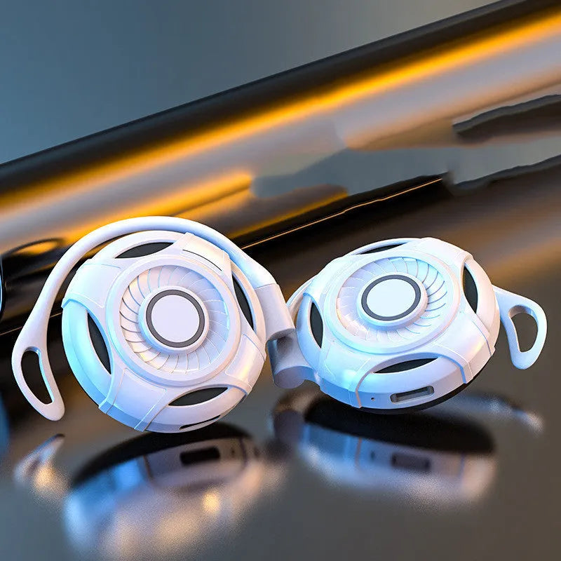 Black and white Bluetooth gaming earphones with hanging ear design and USB charging cable