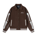 Women's apricot wool jacket with bone embroidery on the front, showing casual fit and stitch detail.