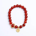 Natural red agate bracelet with hand-woven cord in national style, shown with blessing card.