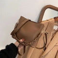 Retro woven PU leather crossbody bucket bag in an androgynous style.