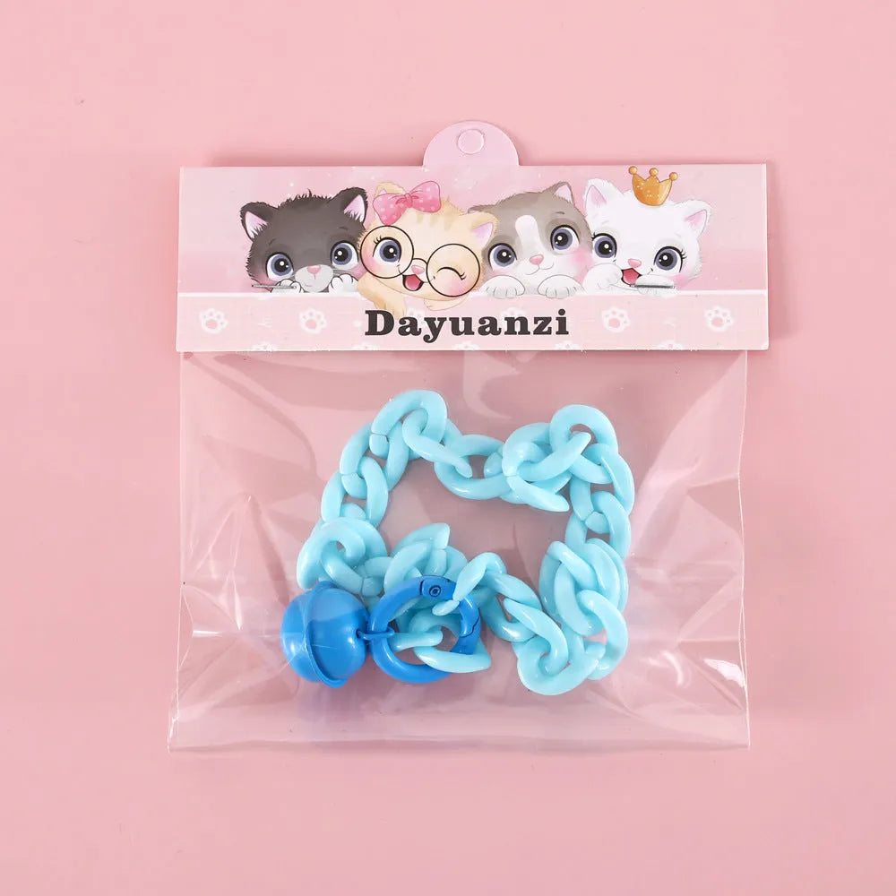Macaron candy colour plastic collar for pet dog cat rabbit on a blue background.