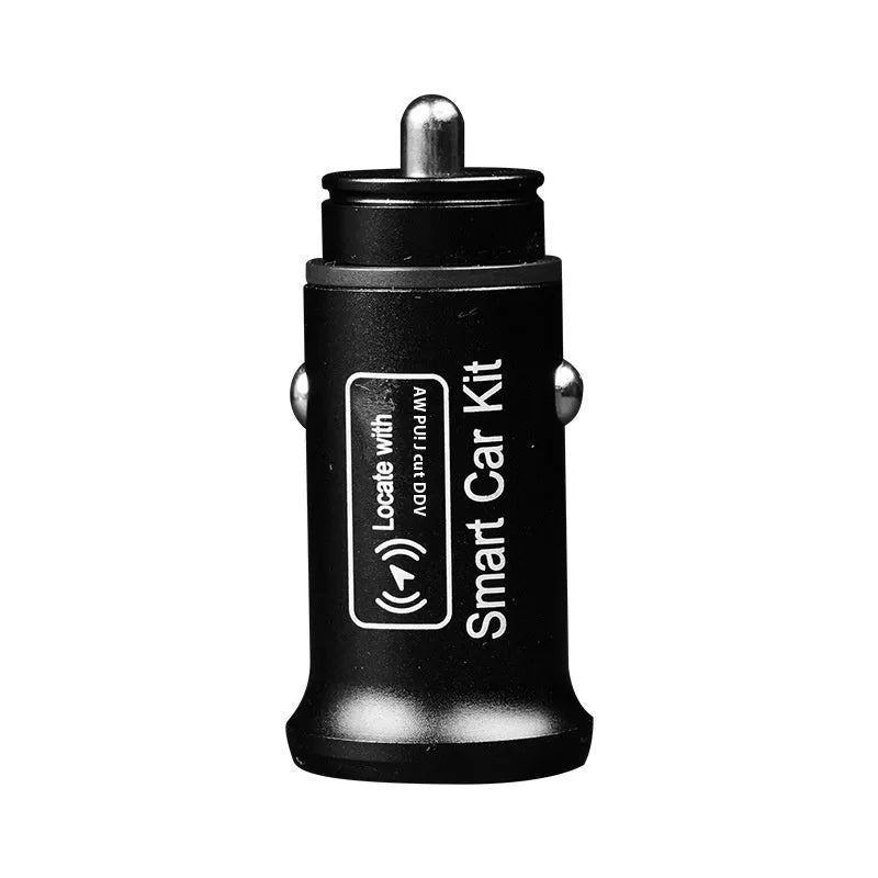 Black GPS car locator tracker with car charger on a table