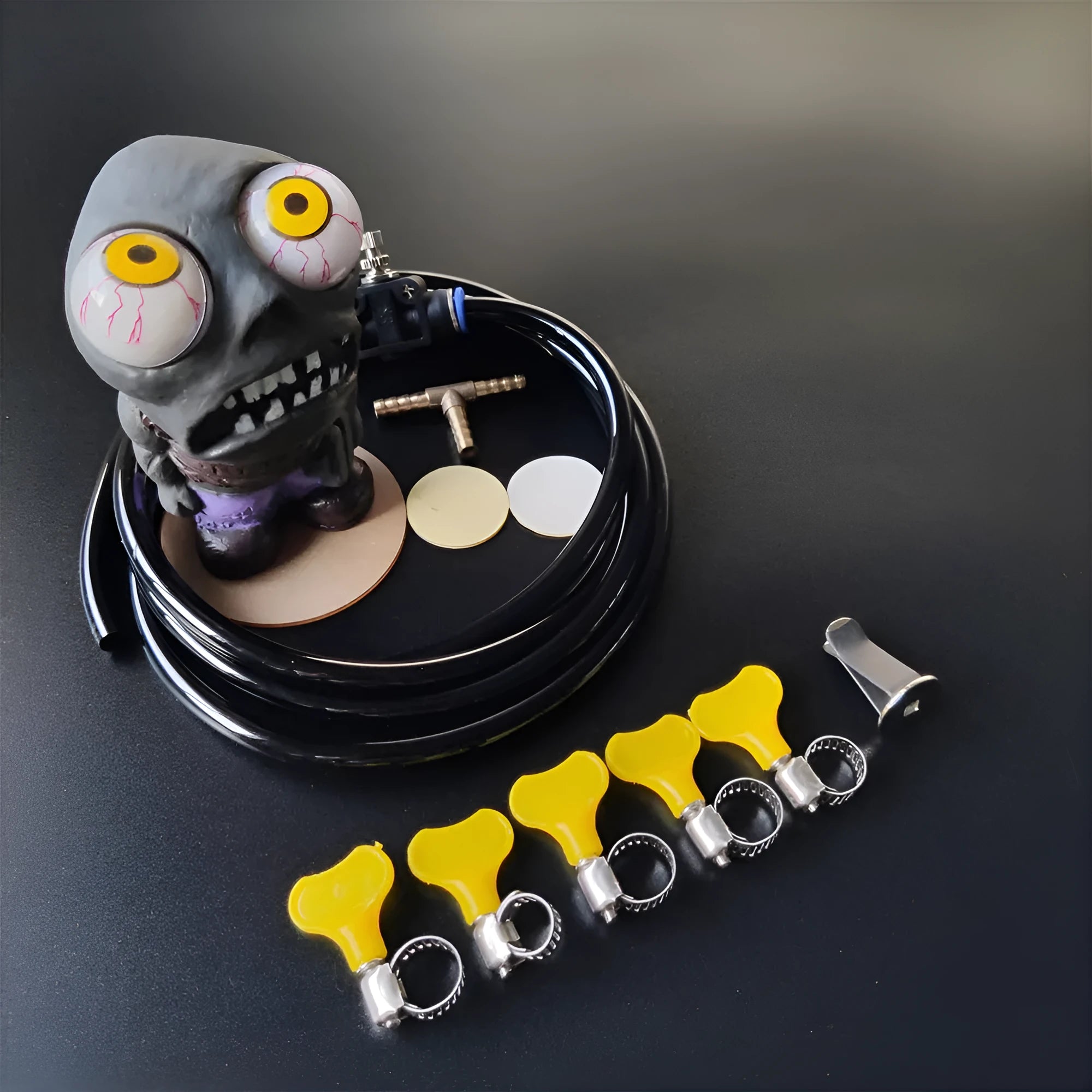 Turbo car boost eye zombie rubber doll with pressure valve and copper tubing installation kit.