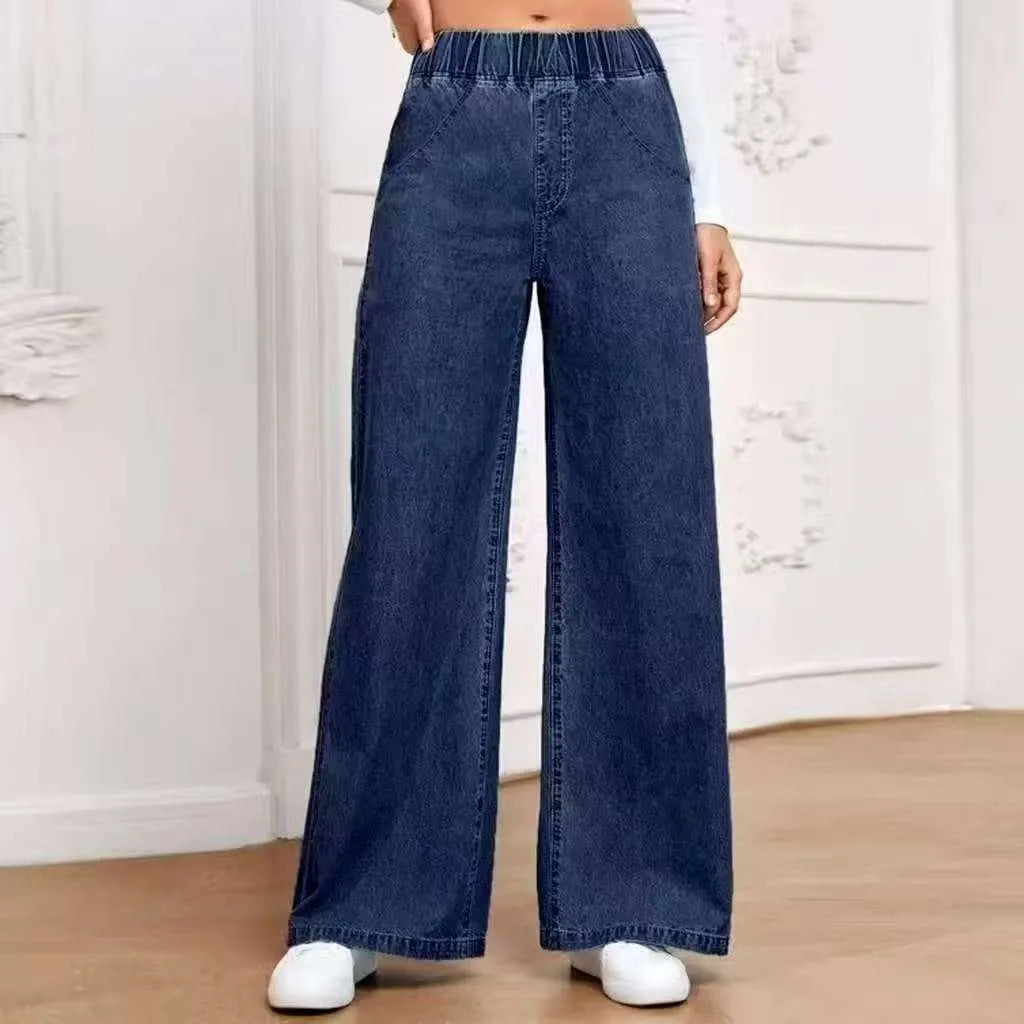 Light blue washed wide-leg denim jeans on a hanger, showing straight leg and mid waist design.