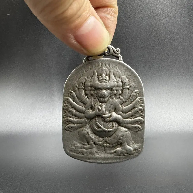 Close-up of iron hanging ornament pendant depicting Aryaacalanatha, Yamantaka in Chinese style.