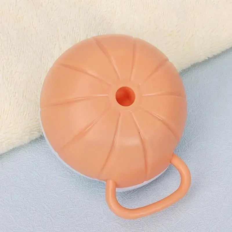 Orange TPR pet bath brush with shampoo dispenser and silicone bristles for dog and cat grooming