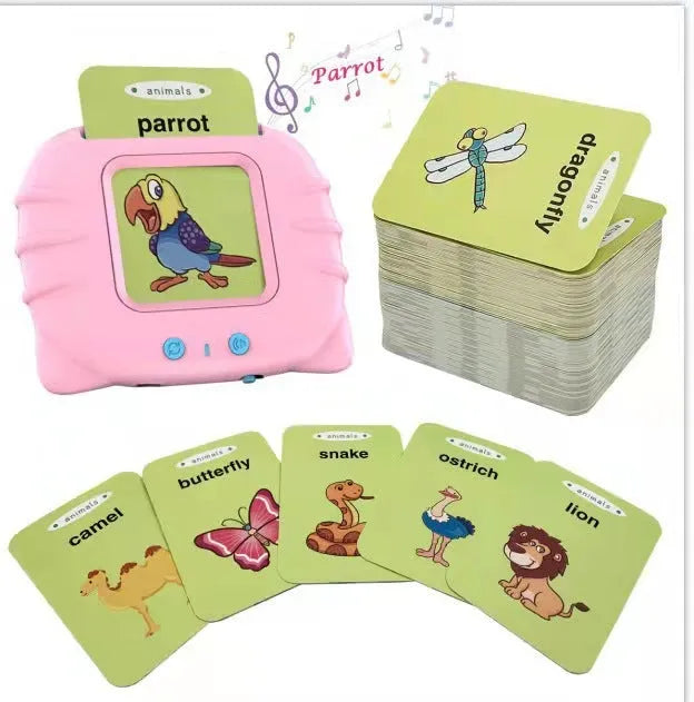 Blue children's learning machine with audio book cards on a table