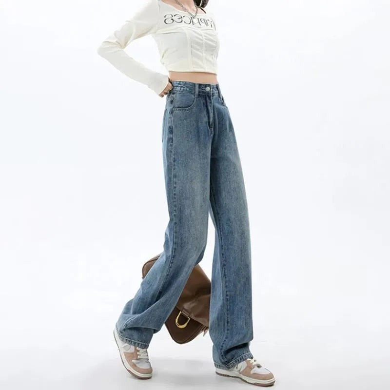 Woman wearing retro blue high-waisted wide-leg jeans with a straight-leg cut.