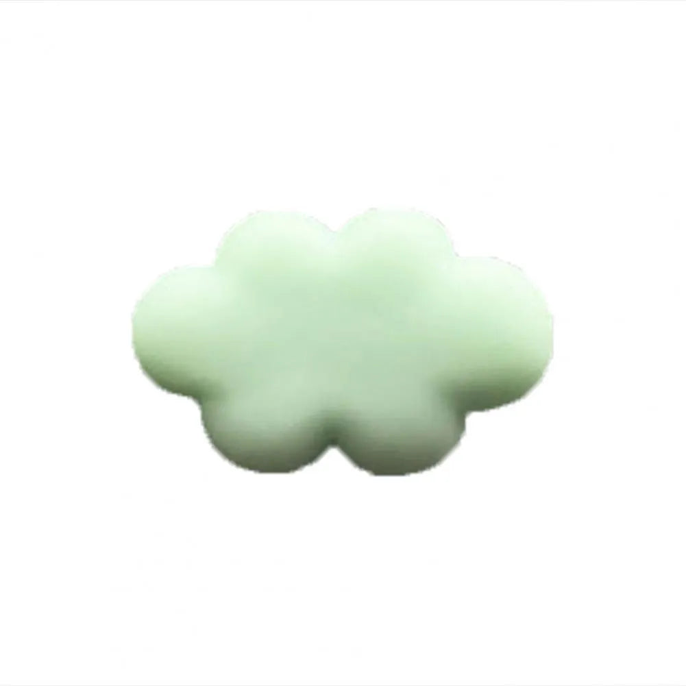 Resin Baiyun cartoon car fragrance clip in light green colour attached to a car air vent