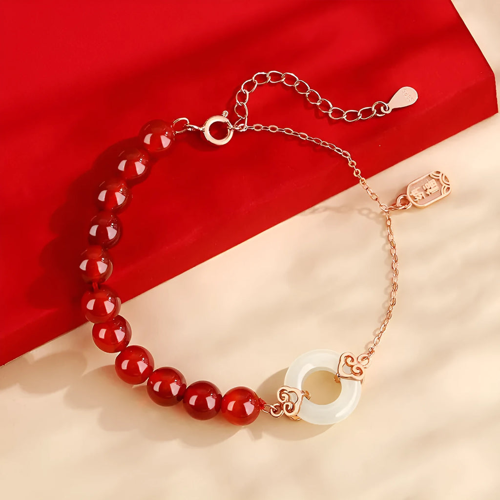 Sterling silver 925 bracelet with a peace buckle charm, xiangyun designs, and a fu character.