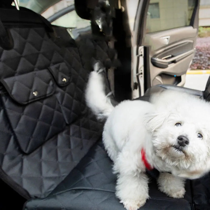 Black polyester two-seater car rear pet mat, waterproof and scratch-resistant, laid across a car seat