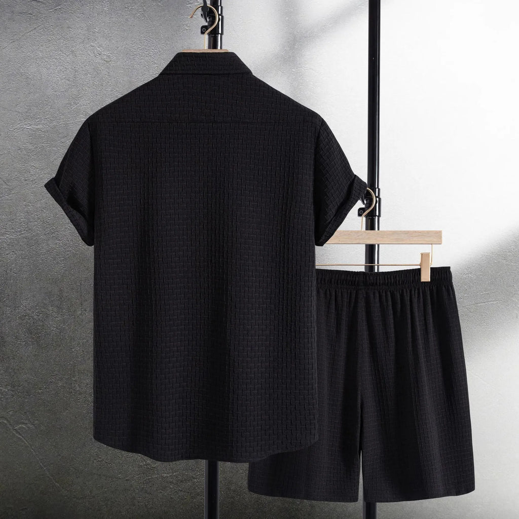 Men's black cotton blend short sleeve shirt and shorts suit set on a hanger.