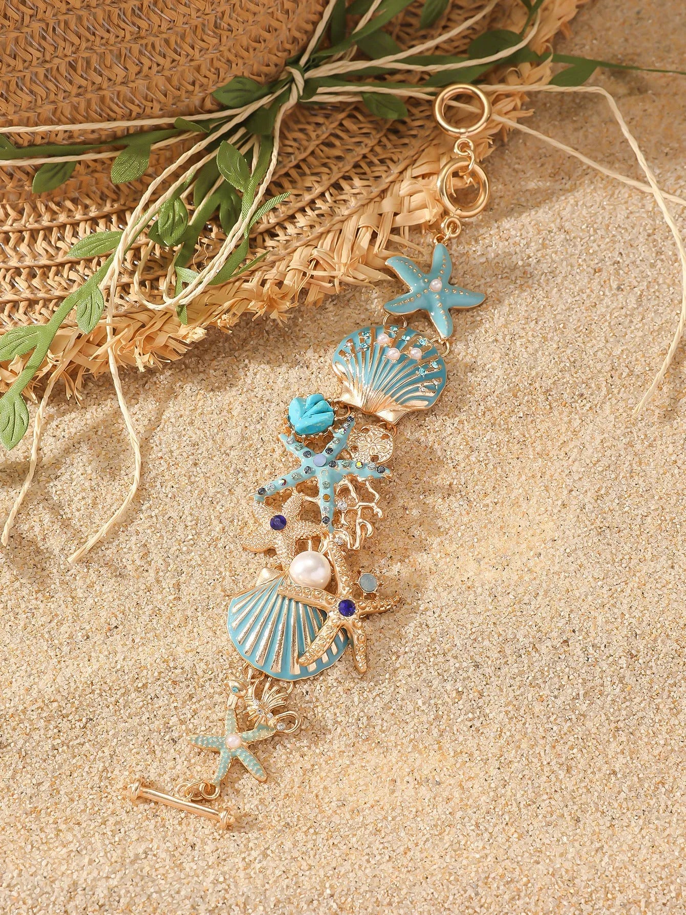 Alloy marine-themed bracelet with anchor and starfish charms in blue colour