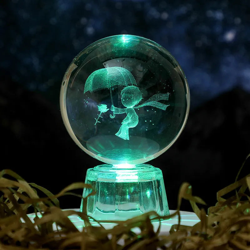 Transparent white luminous crystal ball ornament with inner carving on a fixed base for tabletop decor.
