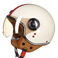 White, red, and green ABS plastic half helmet for motorcycle and electric bicycle riders on a grey background.