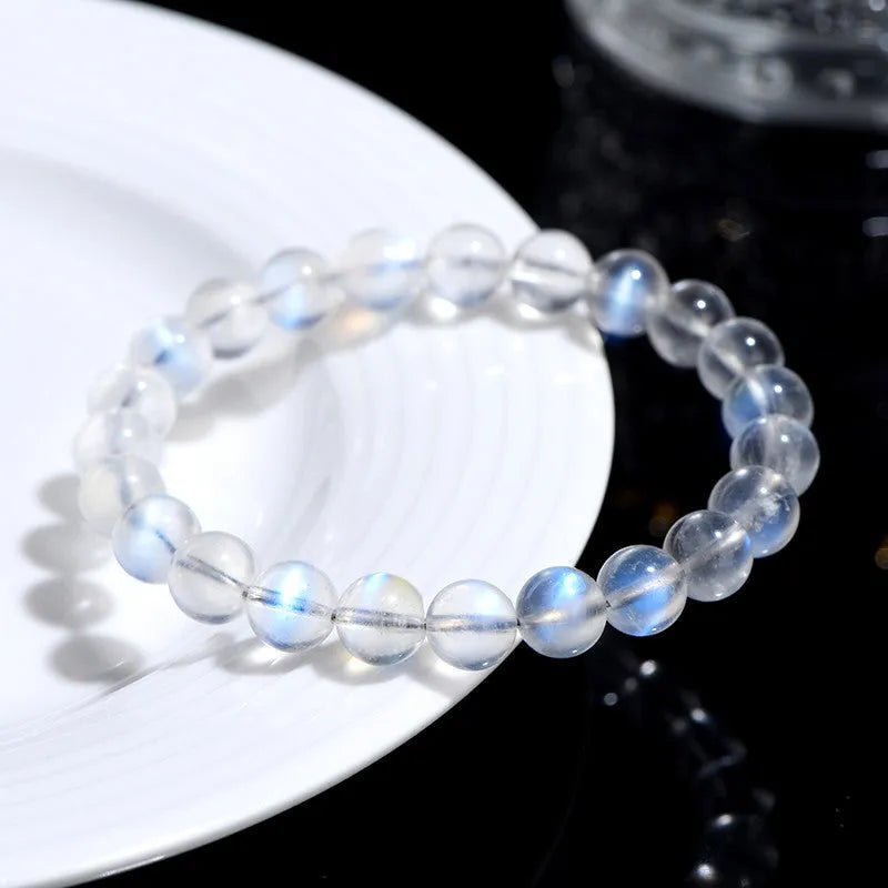 Natural cream body blue moonlight crystal bracelet on a white background showing grinding finish.