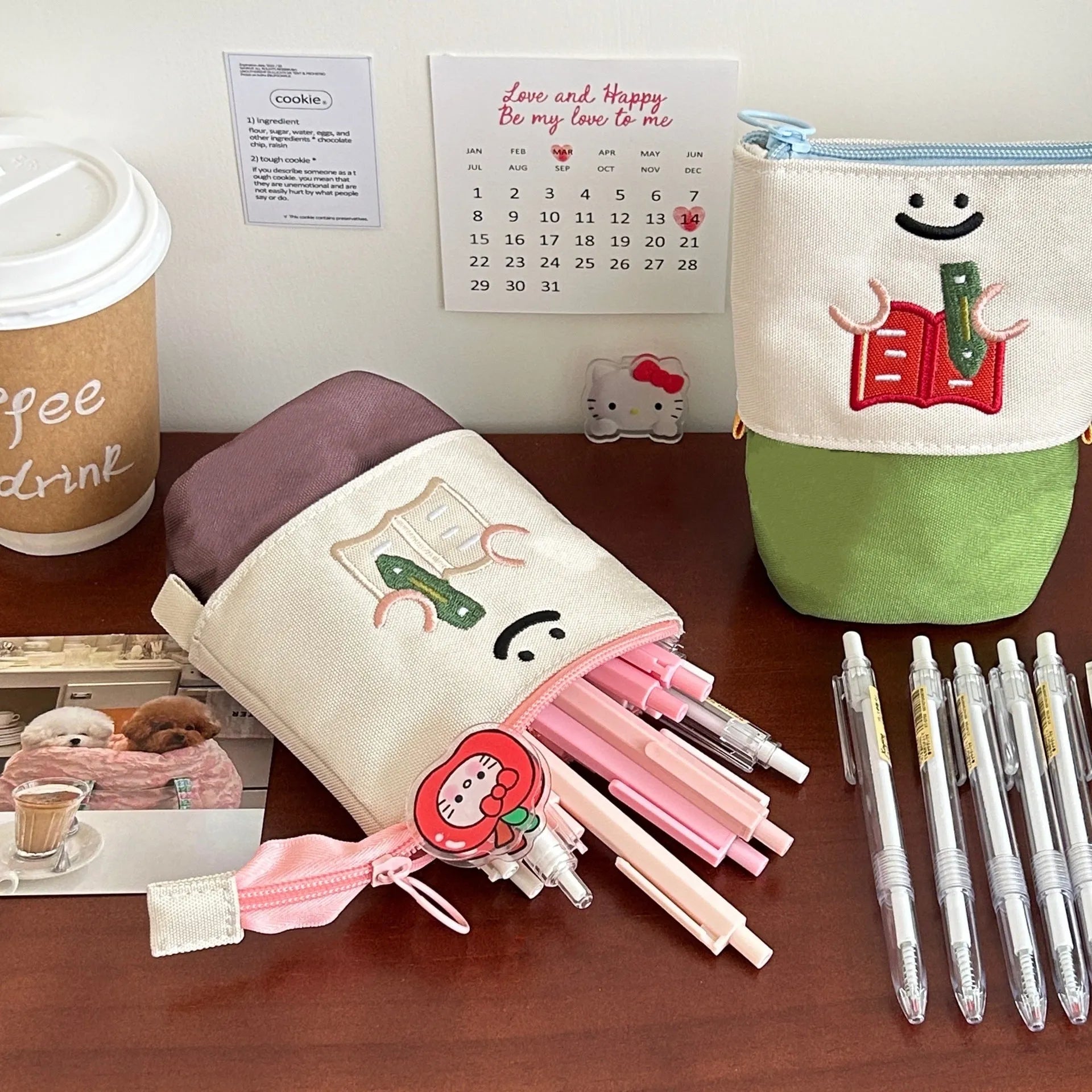 Brown cartoon pattern collapsible pencil case with zipper closure showing interior space