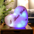 Colourful glowing five-pointed star plush pillow for room decoration.