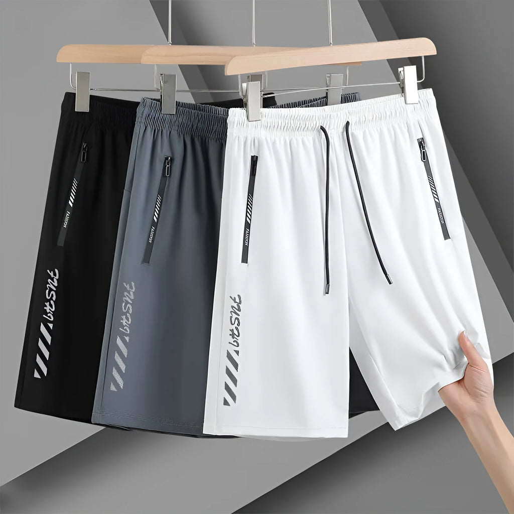 Men's black loose-fit nylon sports shorts on a hanger