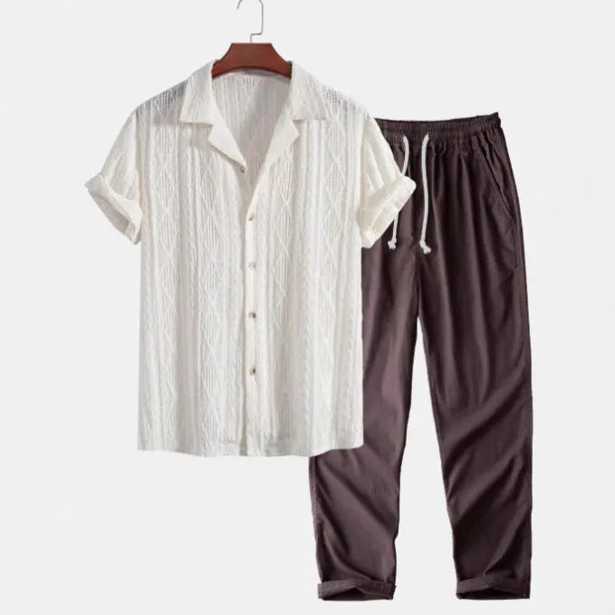 Men's slim-fit camouflage print casual suit consisting of a short-sleeved lapel shirt and matching trousers.