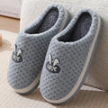 Women's plaid design house slippers with artificial fur upper and thick rubber sole in various colours.