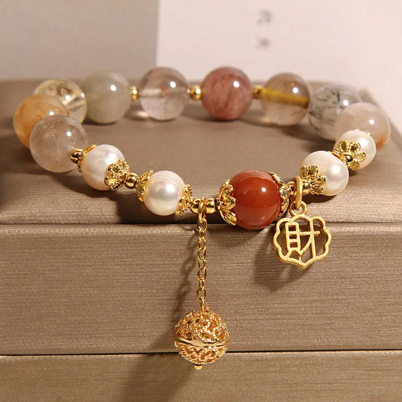 Women's adjustable crystal pearl bracelet with four pearls and Chinese Cai charm in natural hair colours