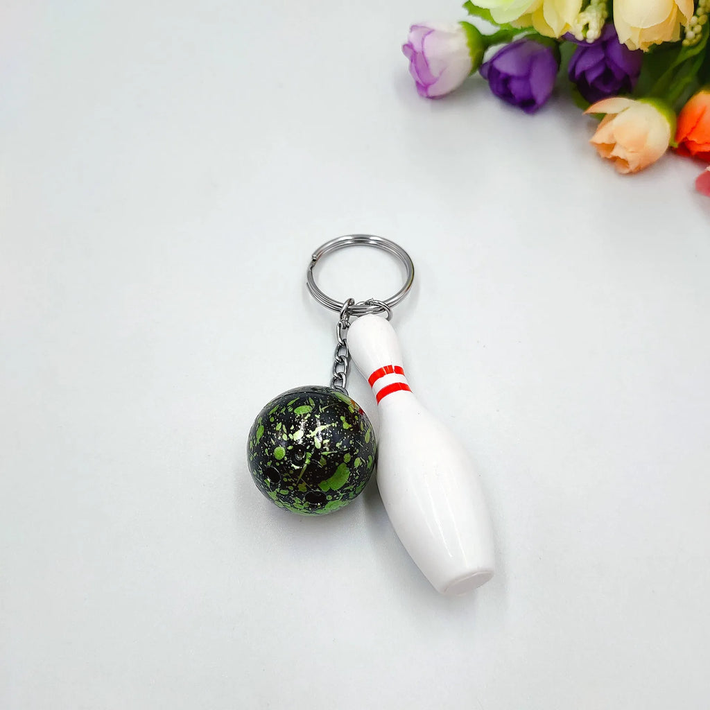 Mini bowling ball keychain pendant in dark red, blue, purple, or green colours