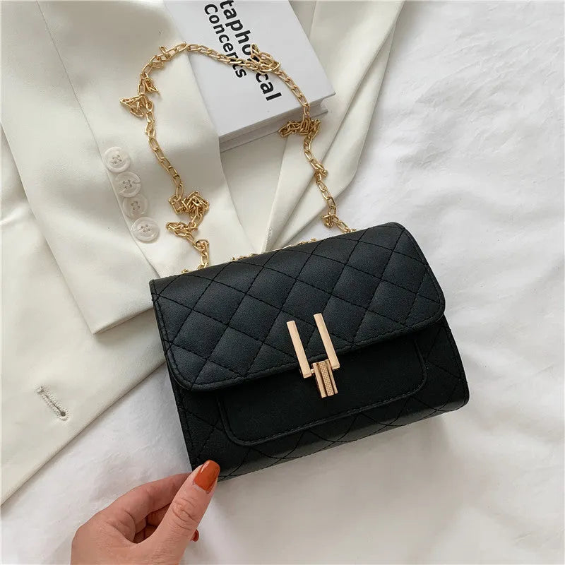 Women's black crossbody bag with diamond lattice chain strap showing 17.5cm width dimensions