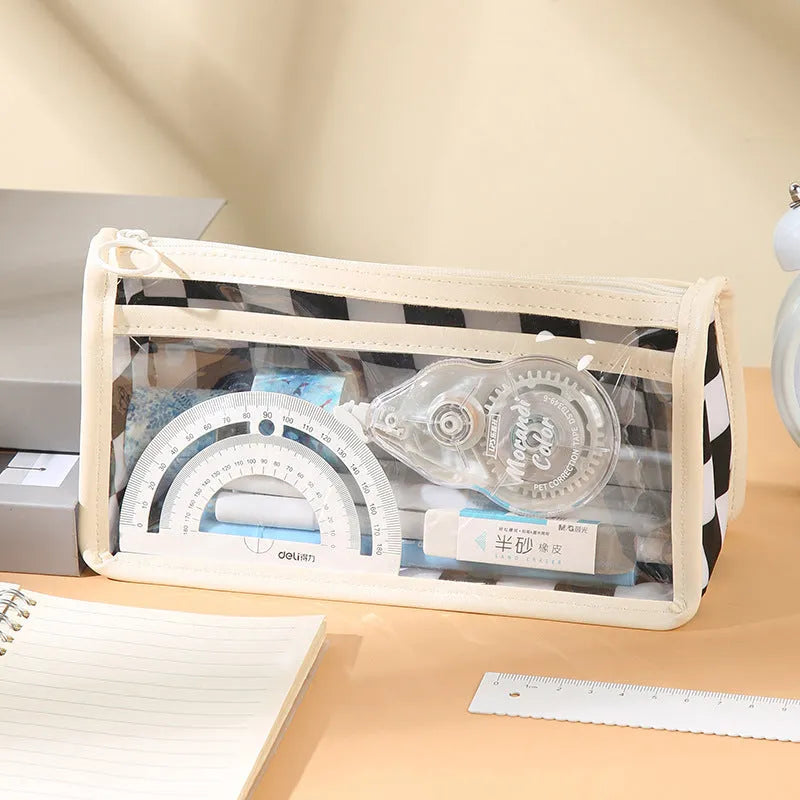 Transparent PVC pencil case with chessboard pattern, open to show large interior for pens.