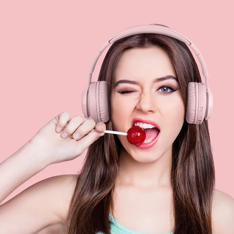 Wireless children's headphones with RGB LED lights in bunny pink colour showing illuminated ear cups